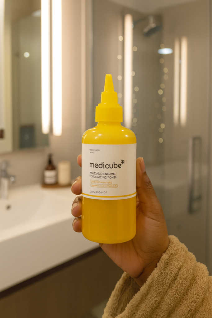 Medicube Tumeric Resurfacting Toner and hand